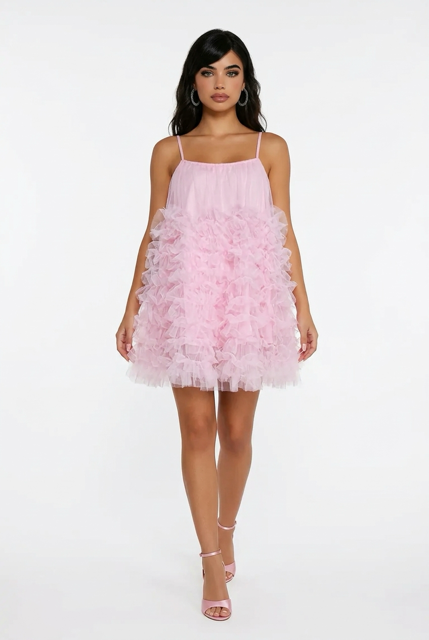 A sleeveless, solid-coloured sundress with a French waistband, ideal for a summer birthday party