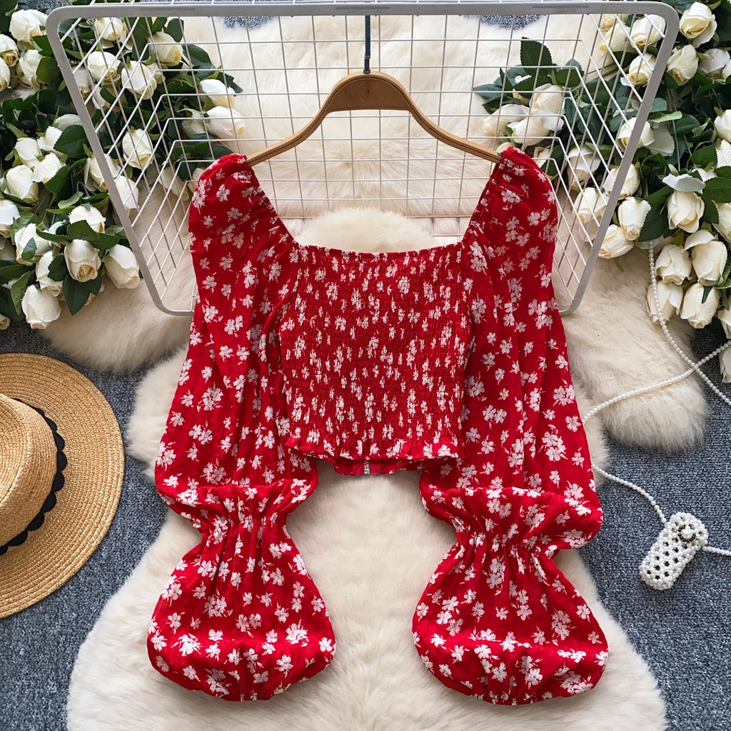 Women’s casual blouses with full sleeves, square collars, lantern sleeves, floral patterns, and zippers. Wholesale women’s clothing.