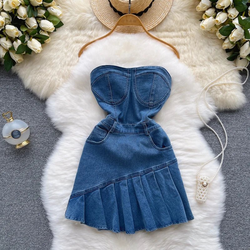 A strapless, summery new slim-fit denim A-line dress worn by a hottie.