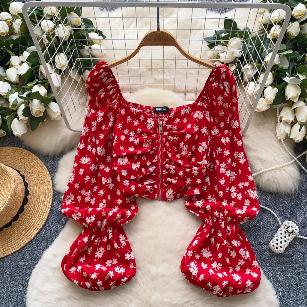 Women’s casual blouses with full sleeves, square collars, lantern sleeves, floral patterns, and zippers. Wholesale women’s clothing.