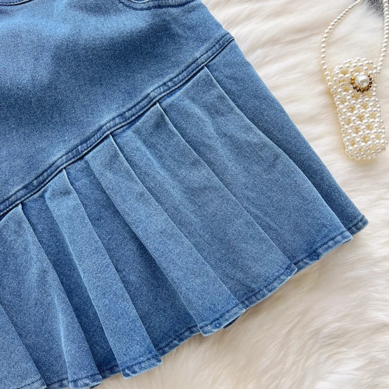 A strapless, summery new slim-fit denim A-line dress worn by a hottie.