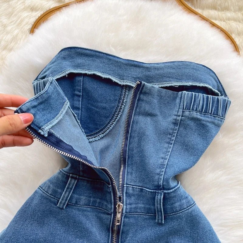 A strapless, summery new slim-fit denim A-line dress worn by a hottie.