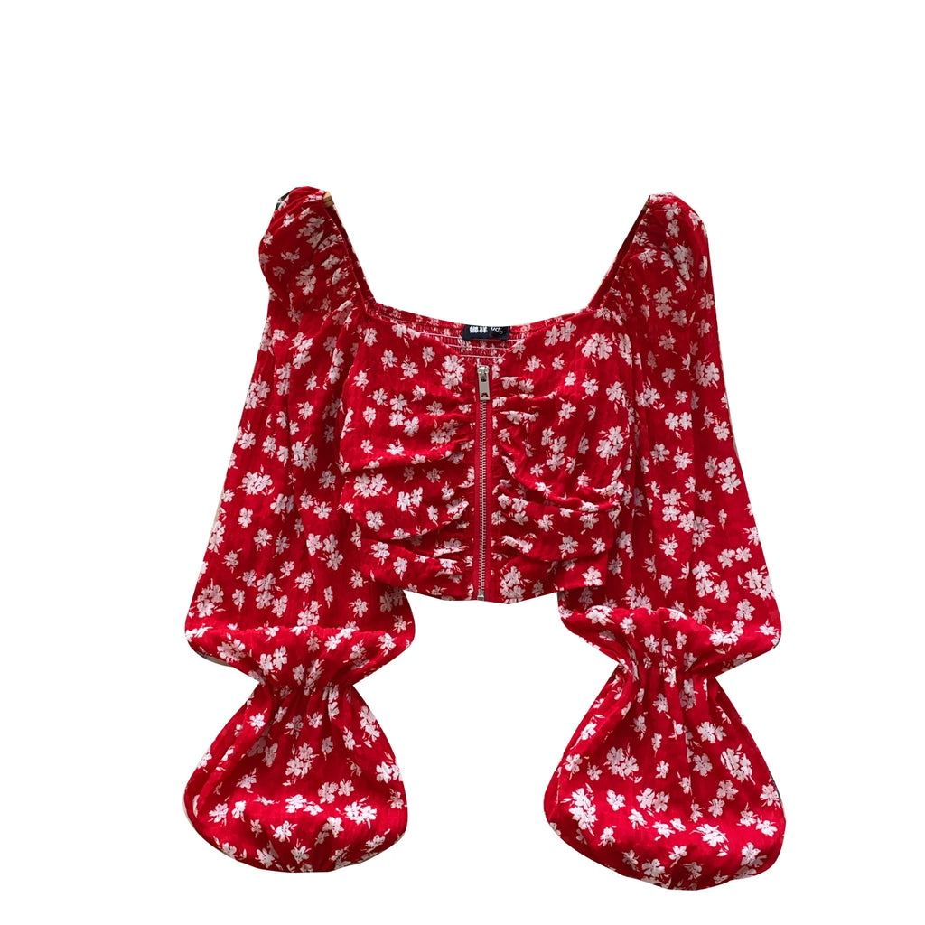 Women’s casual blouses with full sleeves, square collars, lantern sleeves, floral patterns, and zippers. Wholesale women’s clothing.