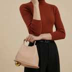 A unique, irregular hand-held bucket design crafted from luxurious pu leather.