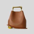 A unique, irregular hand-held bucket design crafted from luxurious pu leather.