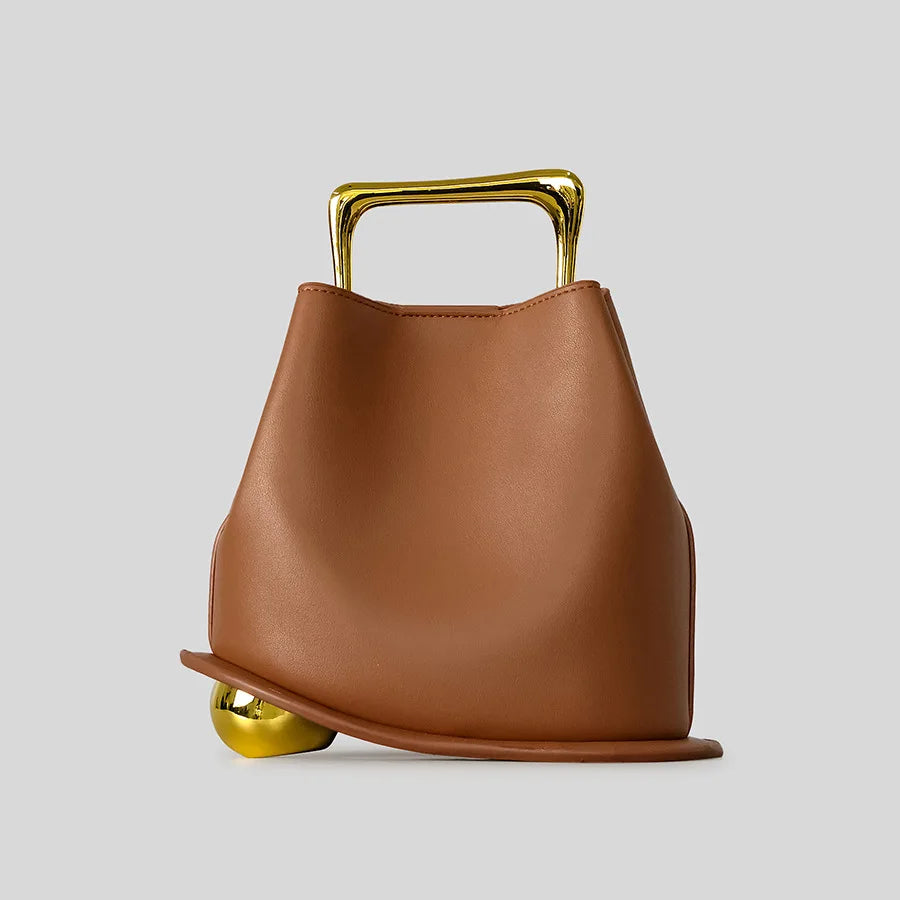 A unique, irregular hand-held bucket design crafted from luxurious pu leather.