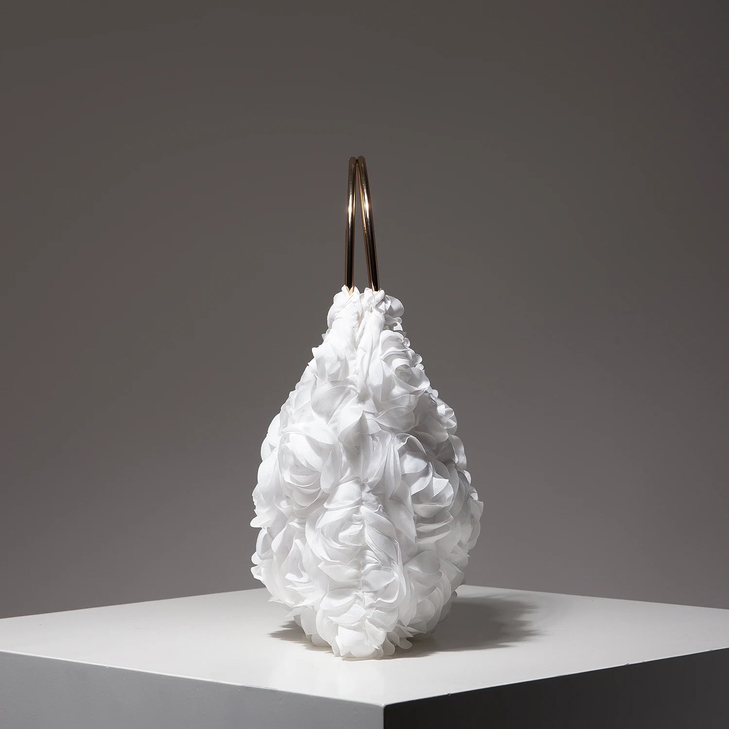 Ladies’ elegant tote bags, prom dresses, and party bags with random patterns.