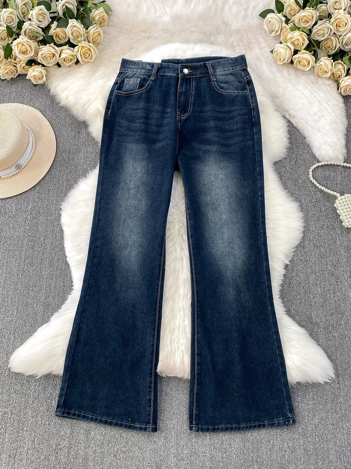 A pair of small-sized, retro American blue denim flared pants with heightening slim elastic, perfect for casual winter wear.