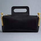A luxurious designer bag for women with a two-sided clamp frame and a kiss lock.