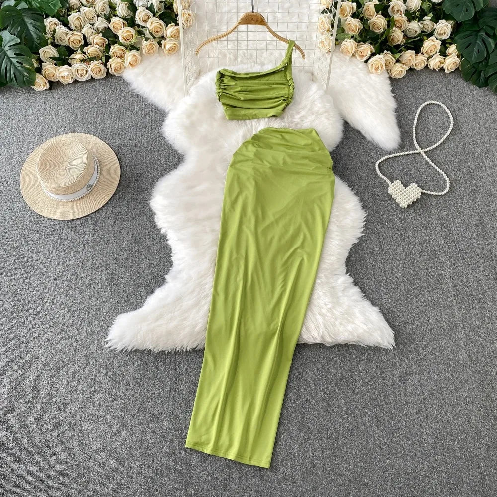 A stylish two-piece set of a split hollow-out slim slip dress and a casual beach party-ready vintage dress, perfect for women’s summer fashion.