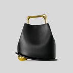 A unique, irregular hand-held bucket design crafted from luxurious pu leather.