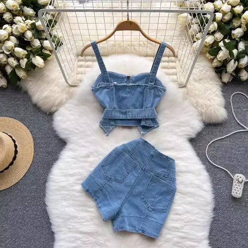 A new denim two-piece set for women includes a suspender zipper belt tunic camis top and a high-waisted double-pocketed summer suit.
