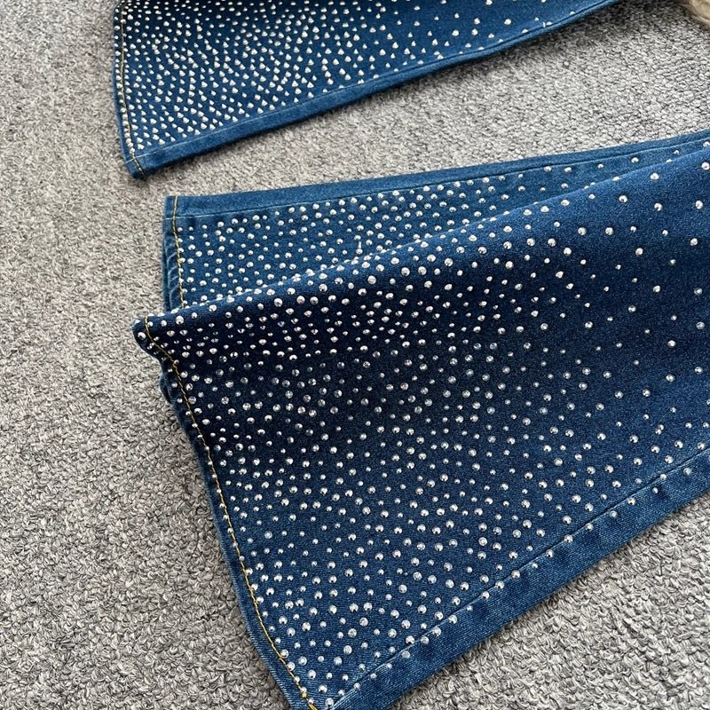 A stylish women’s summer outfit featuring a versatile sleeveless strapless vest with rhinestones and high-waisted denim trumpet pants.