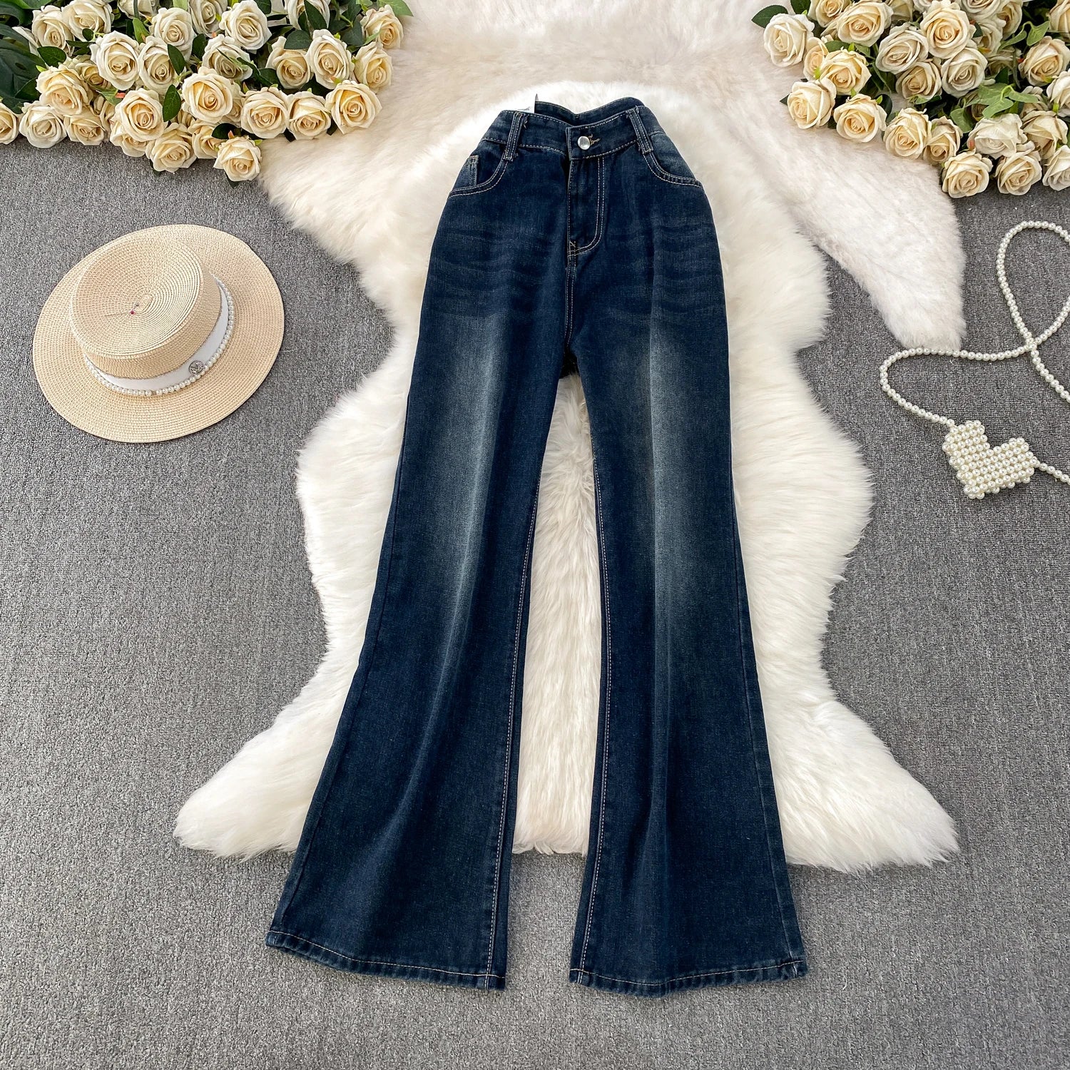 A pair of small-sized, retro American blue denim flared pants with heightening slim elastic, perfect for casual winter wear.