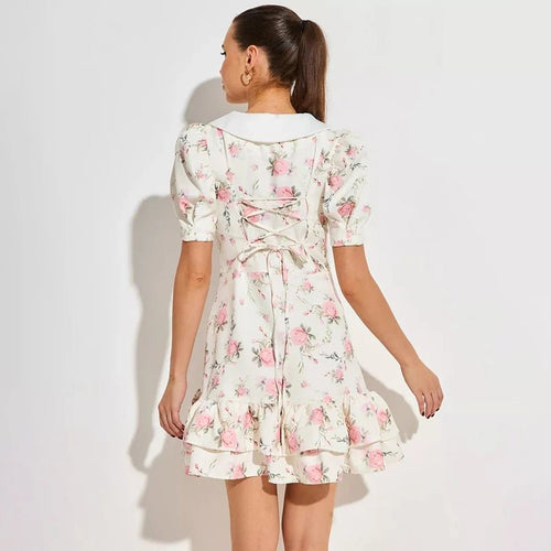 A casual vacation dress for women with tornova print puff sleeves, ruffles, a V-neckline, a high waist, pearl buttons, and a mini length.