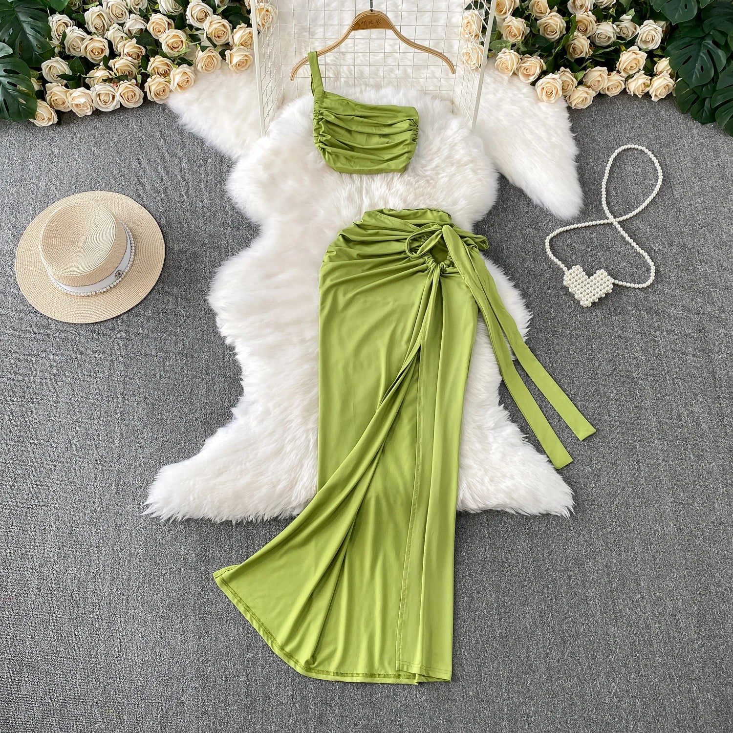 A stylish two-piece set of a split hollow-out slim slip dress and a casual beach party-ready vintage dress, perfect for women’s summer fashion.