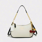 A stylish shoulder bag for women, featuring a soft lychee pattern and a casual design.