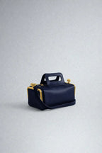 A luxurious designer bag for women with a two-sided clamp frame and a kiss lock.