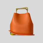 A unique, irregular hand-held bucket design crafted from luxurious pu leather.