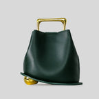 A unique, irregular hand-held bucket design crafted from luxurious pu leather.