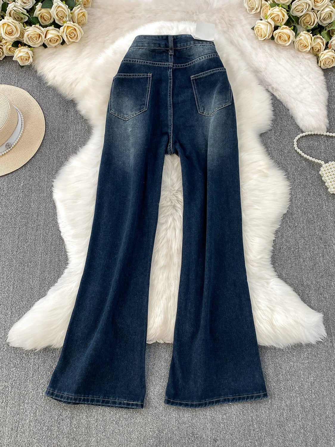 A pair of small-sized, retro American blue denim flared pants with heightening slim elastic, perfect for casual winter wear.