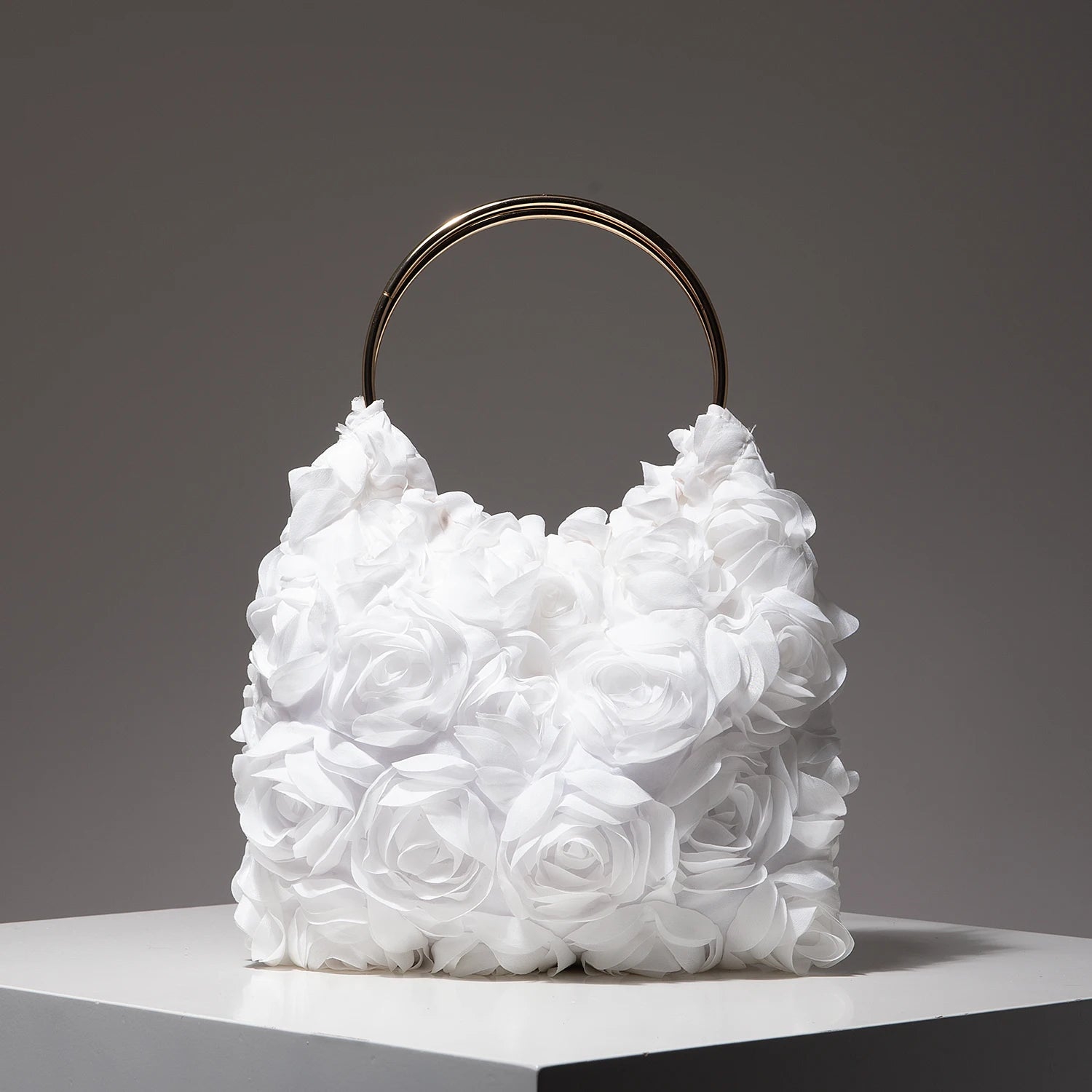 Ladies’ elegant tote bags, prom dresses, and party bags with random patterns.