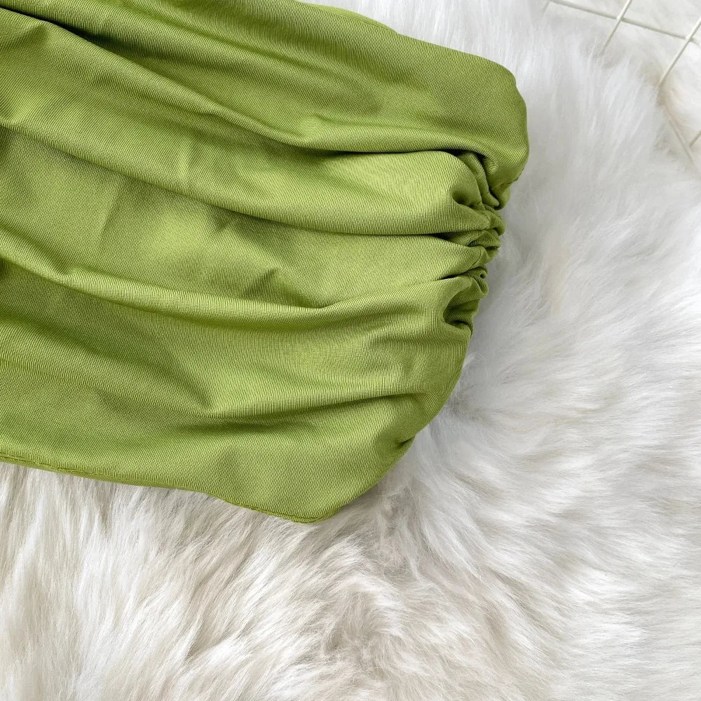 A stylish two-piece set of a split hollow-out slim slip dress and a casual beach party-ready vintage dress, perfect for women’s summer fashion.