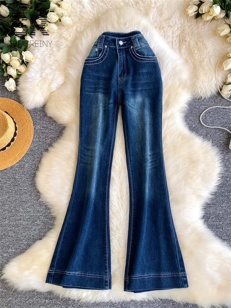 High-waisted, distressed French-inspired jeans with a versatile design, perfect for office wear.