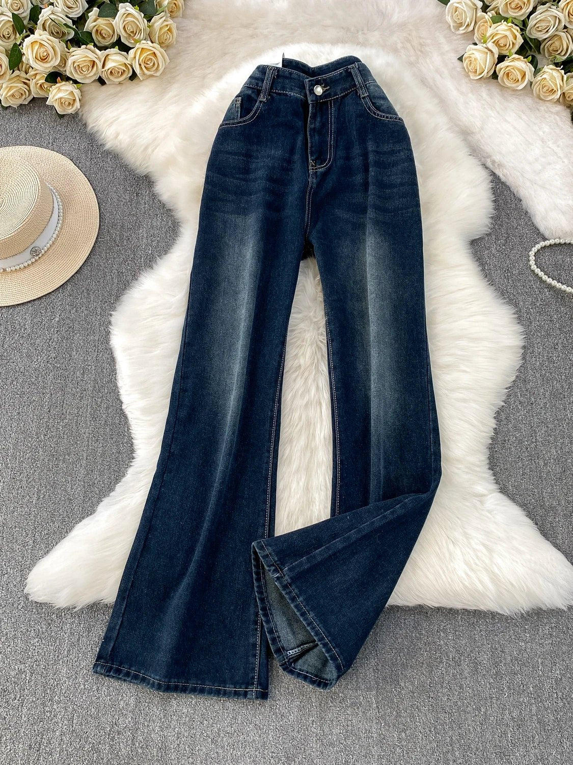 A pair of small-sized, retro American blue denim flared pants with heightening slim elastic, perfect for casual winter wear.